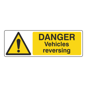 Hazard sign stating danger, vehicles reversing