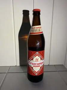 A full 660ml bottle of Cruzcampo.