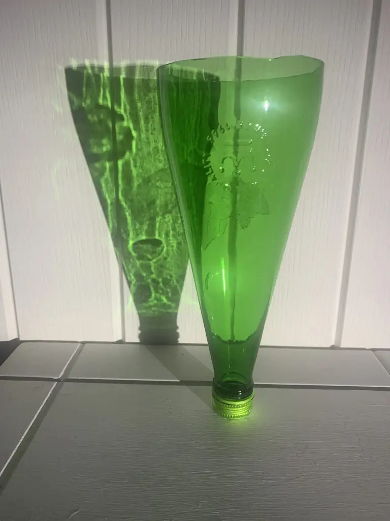 A Bottle Green bottle that has been cut.