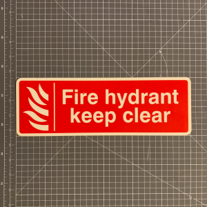 Photoluminescent fire hydrant keep clear sign