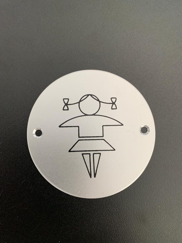 Brushed silver girls toilets sign.