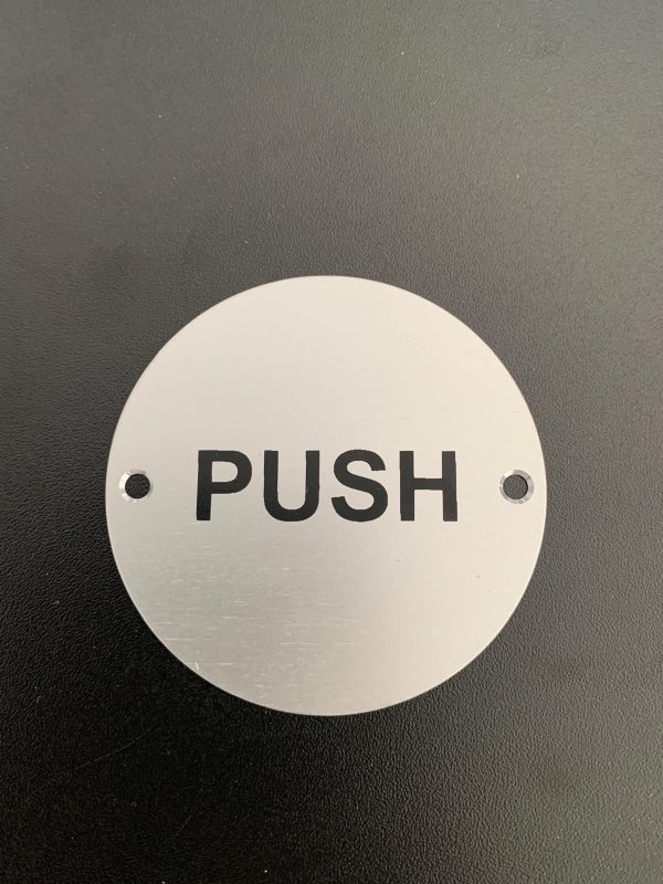 Brushed silver pull sign with screw holes.