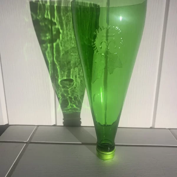 A Bottle Green bottle that has been cut.